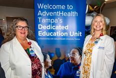 Nursing leaders from AdventHealth Tampa stand in front of the DEU sign