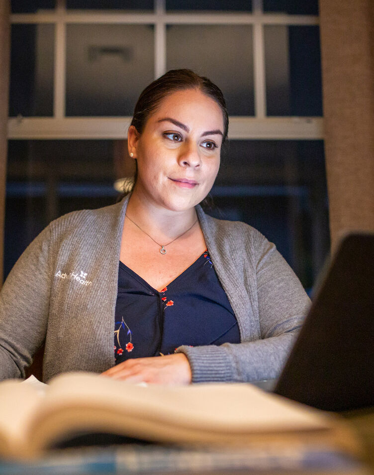 Nurse studying on a laptop