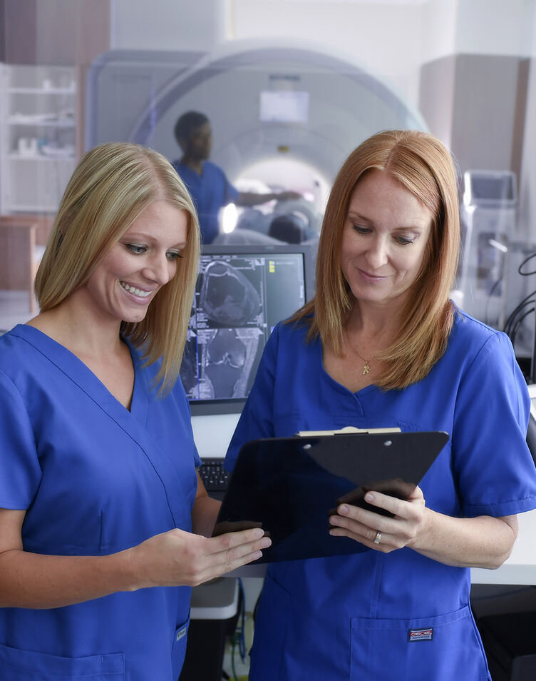 MRI technicians looking at report